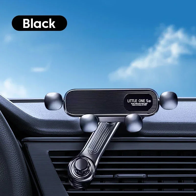 Black car phone holder on a car dashboard with a blue sky background