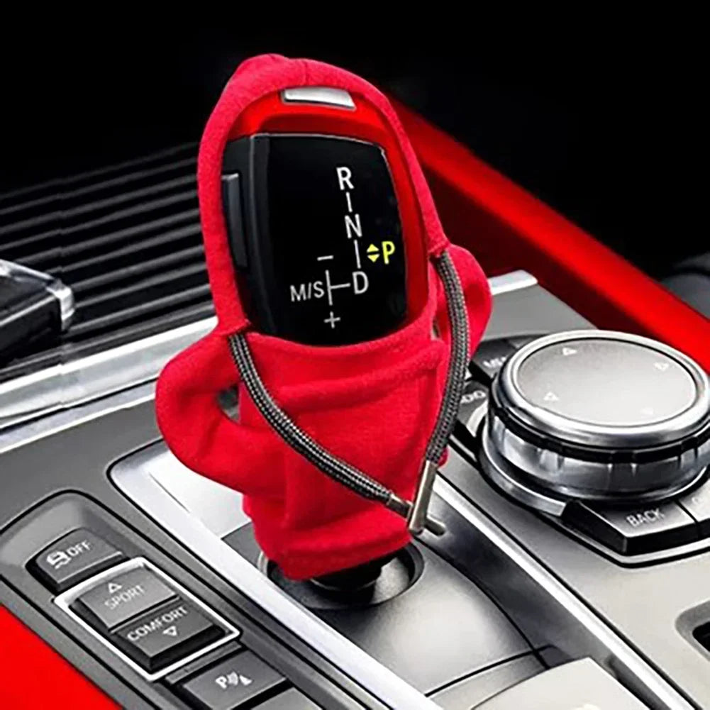 Car gear shift cover with red hoodie on a car transmission