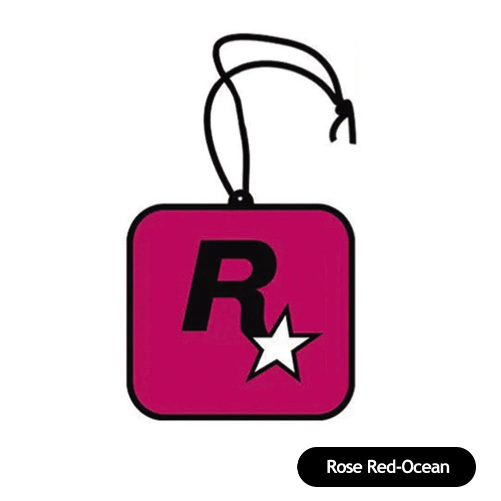 Pink square-shaped keychain with 'R' and star design on a white background