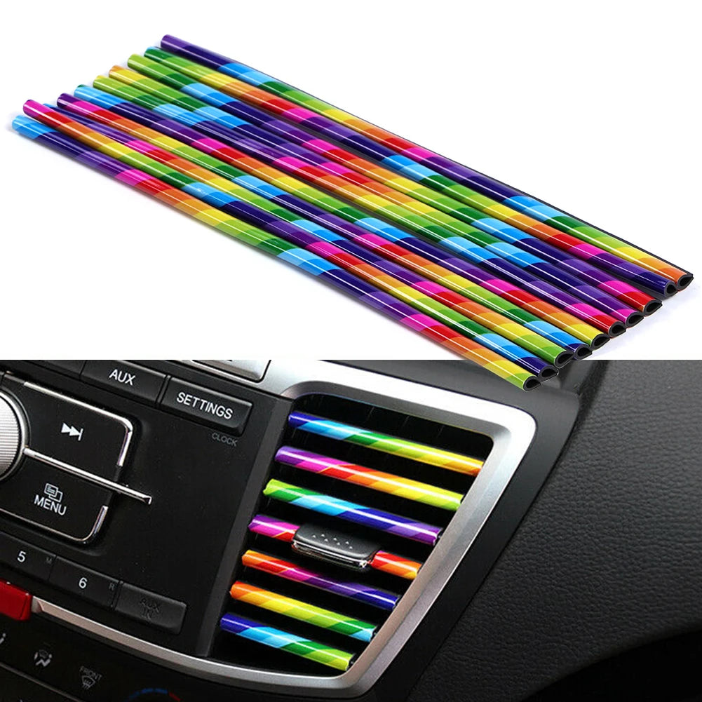Set of colorful car air vent decorative strips on a car dashboard.