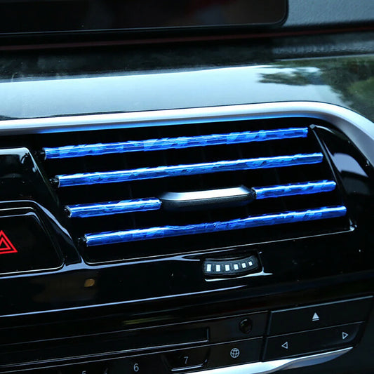 Car air vent with blue LED lights inside a vehicle
