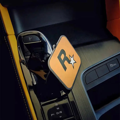 Car interior with a 'R' logo on a yellow background