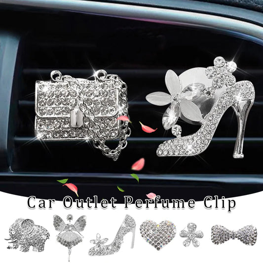 Car outlet perfume clip shaped like a high heel and handbag with decorative elements.