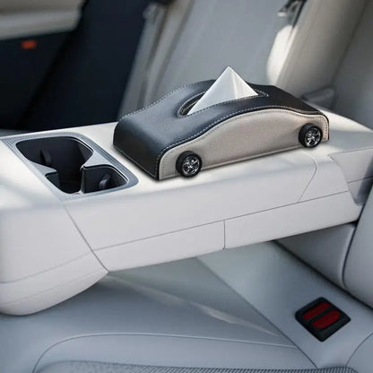 Car tissue holder with tissues on a car's console tray.