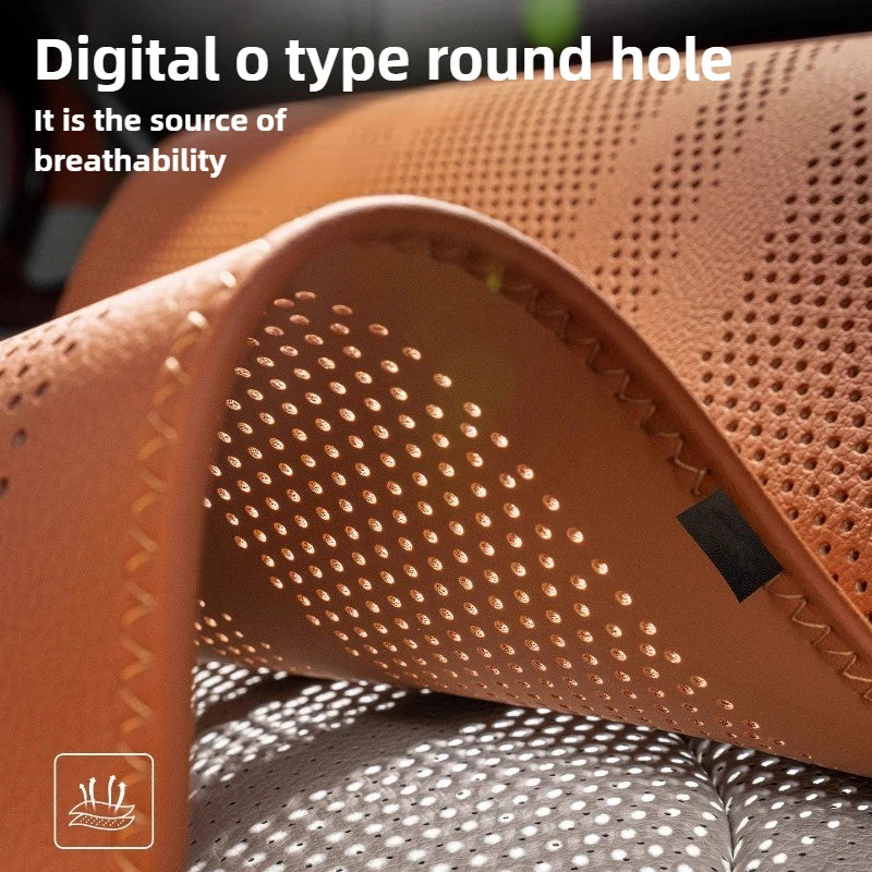 Close-up of a brown sandal with perforated design on a gray surface.
