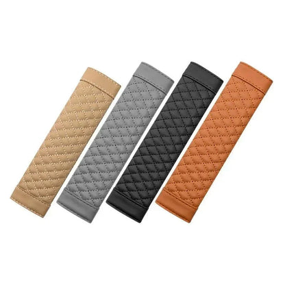 Four quilted fabric strips in beige, gray, black, and brown seat belt cover