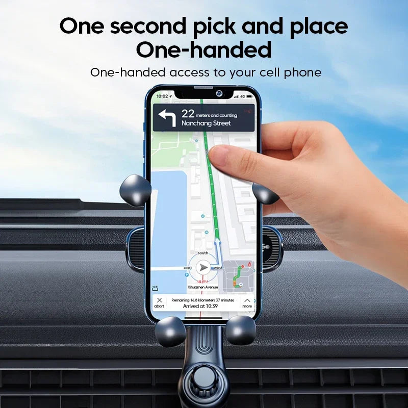 Hand holding a phone with a car mount displaying navigation app on a car dashboard.