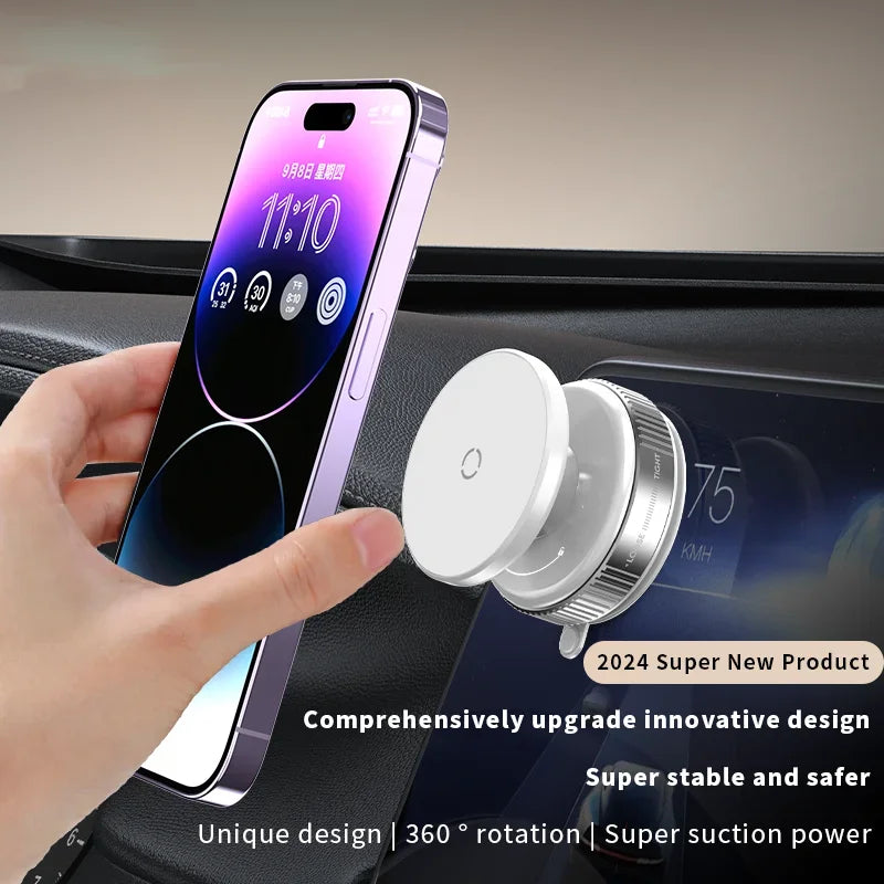 Hand holding a smartphone with a car mount device on a car dashboard.