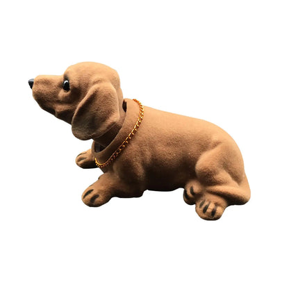 Plush dog toy on a car dashboard