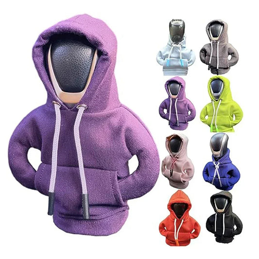 Purple hoodie with a mask on a white background, surrounded by other hoodies in various colors.